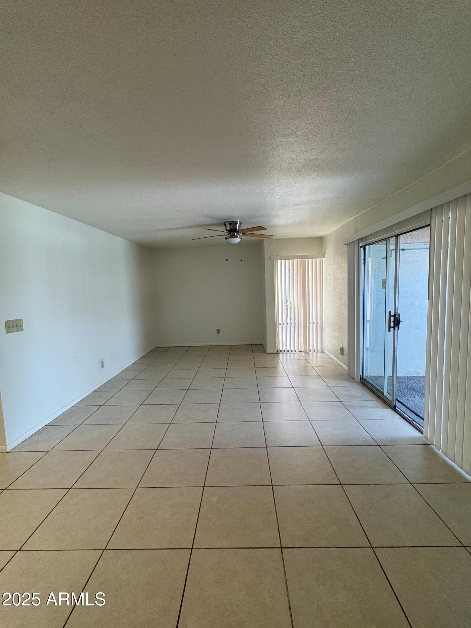 930 South Dobson Road, Unit 23 Mesa, AZ 85202 - Photo 6 of 13 a view of an empty room with a window