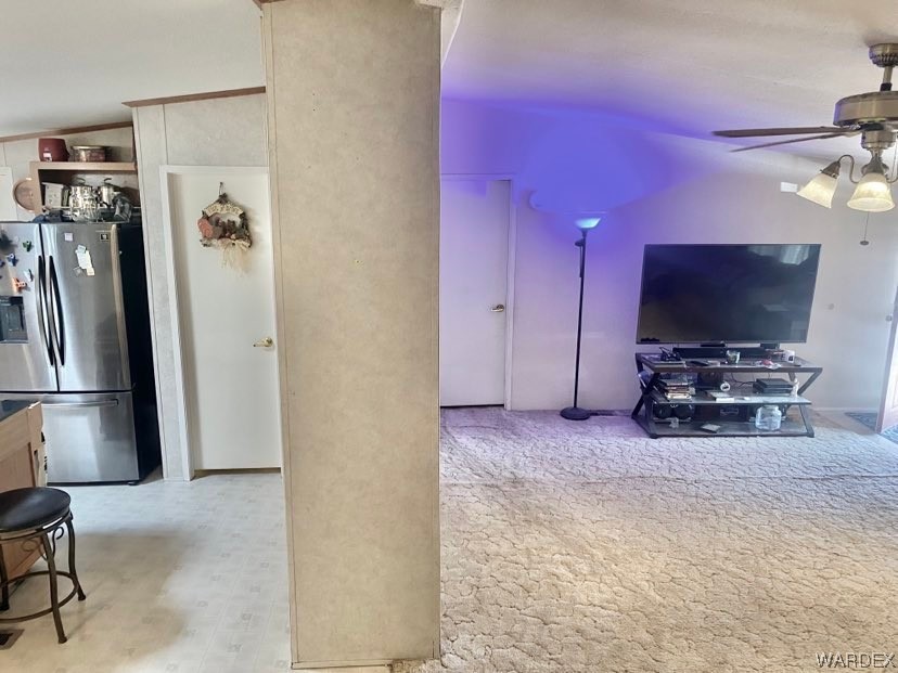 4245 Cibola Road Golden Valley, AZ 86413 - Photo 13 of 21 a room with a flat screen tv and a refrigerator