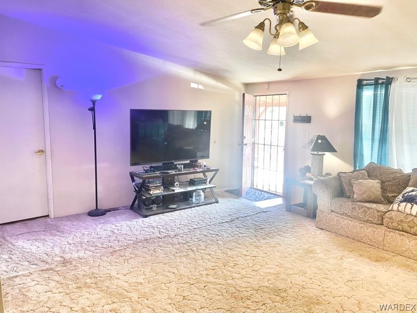 4245 Cibola Road Golden Valley, AZ 86413 - Photo 14 of 21 a living room with furniture and a flat screen tv