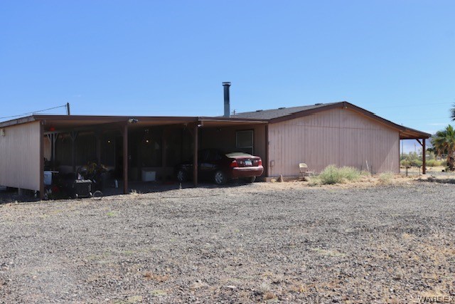 4245 Cibola Road Golden Valley, AZ 86413 - Photo 3 of 21 a front view of a house with a yard