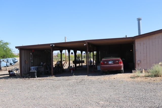 4245 Cibola Road Golden Valley, AZ 86413 - Photo 4 of 21 a view of a car in front of house