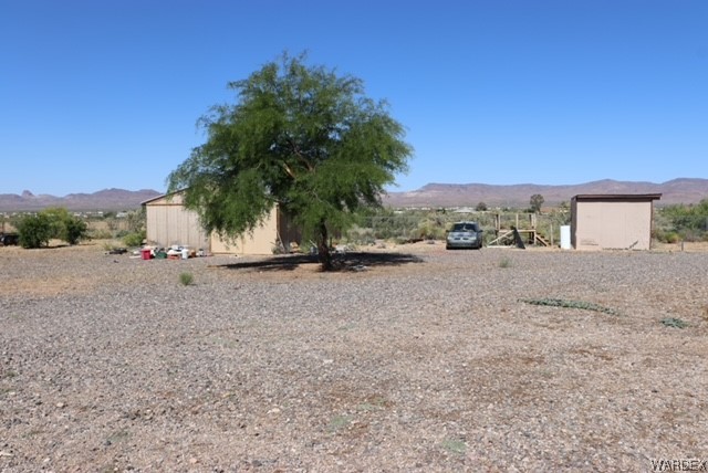 4245 Cibola Road Golden Valley, AZ 86413 - Photo 5 of 21 a view of a road with a building in the background