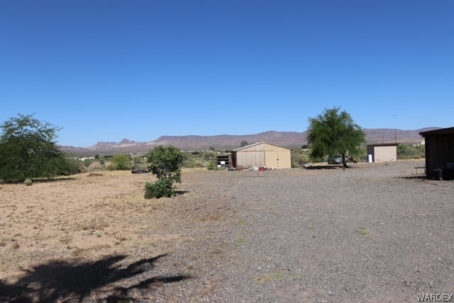 4245 Cibola Road Golden Valley, AZ 86413 - Photo 6 of 21 a view of a road with a building in the background