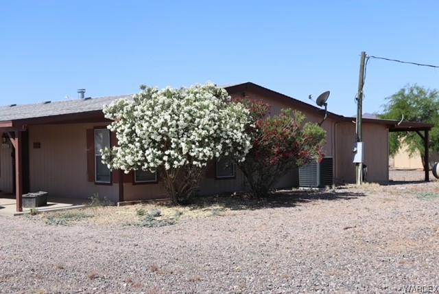 4245 Cibola Road Golden Valley, AZ 86413 - Photo 7 of 21 a view of a house with a tree