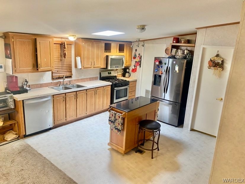4245 Cibola Road Golden Valley, AZ 86413 - Photo 8 of 21 a kitchen with stainless steel appliances granite countertop a refrigerator and a sink