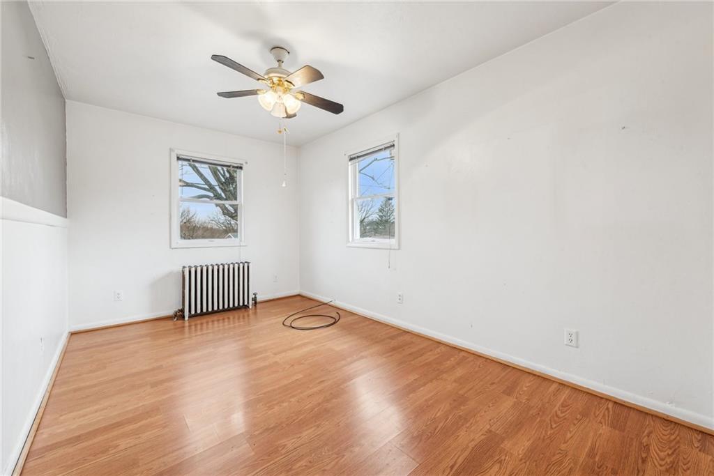 221 Woodside Road Irwin, PA 15642 - Photo 13 of 35 a view of livingroom with a ceiling fan and window