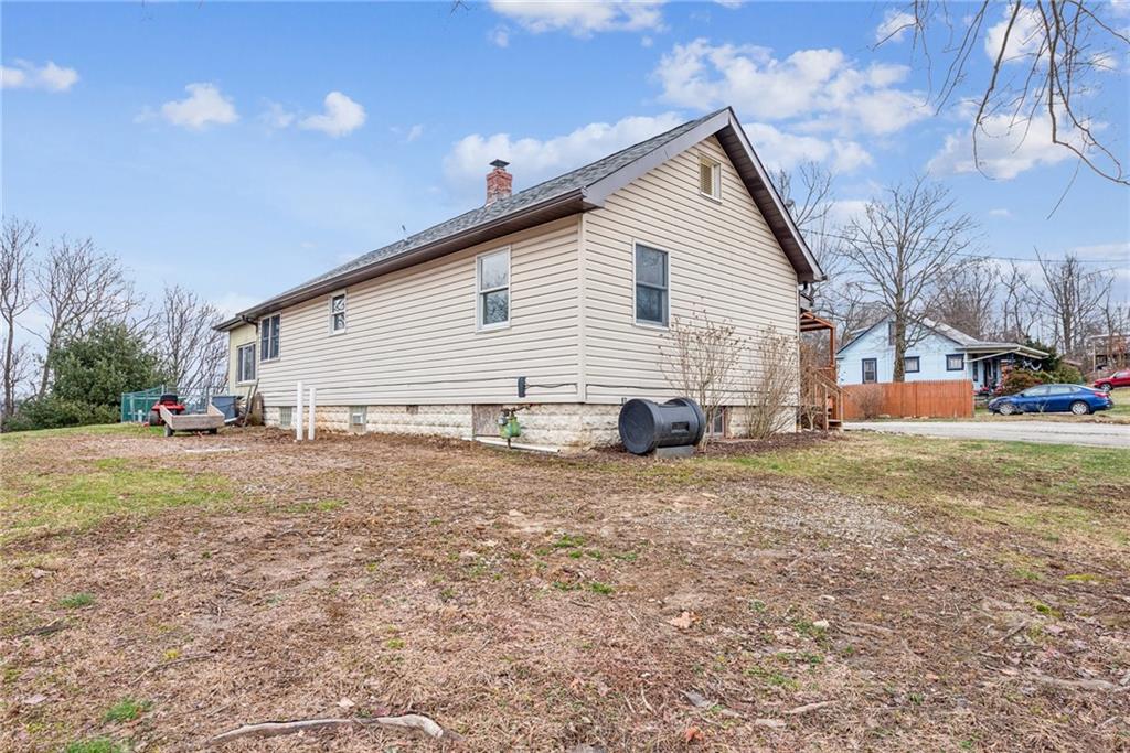 221 Woodside Road Irwin, PA 15642 - Photo 17 of 35 a view of a house with a yard