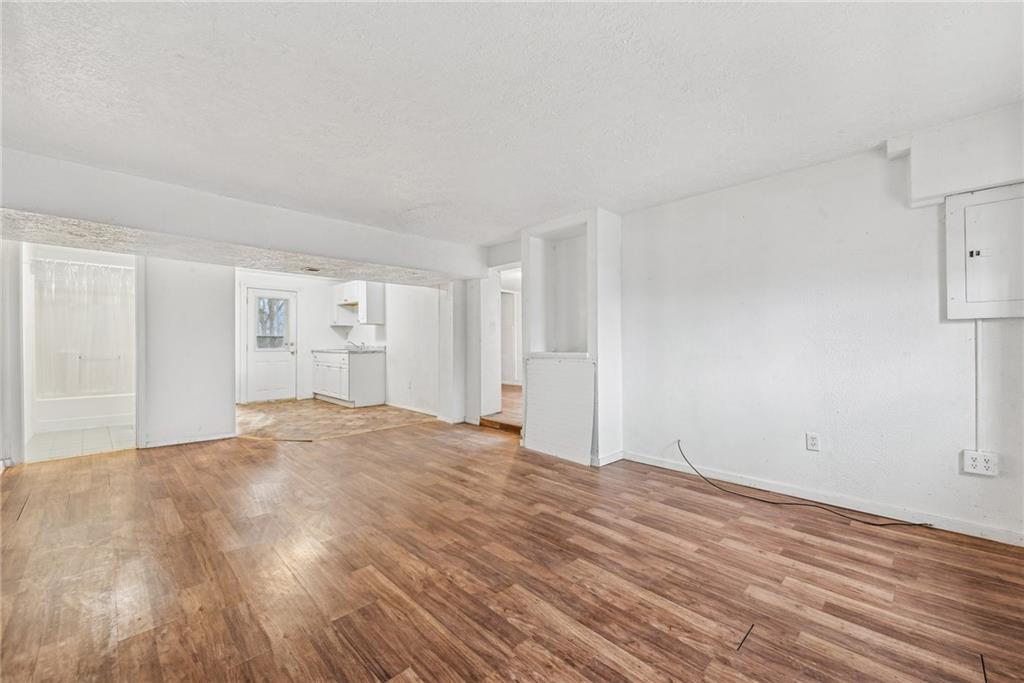 221 Woodside Road Irwin, PA 15642 - Photo 24 of 35 a view of empty room with wooden floor