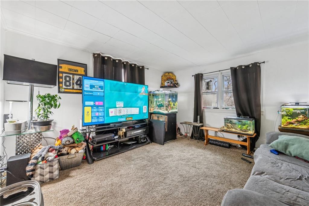 221 Woodside Road Irwin, PA 15642 - Photo 32 of 35 a bedroom with furniture and a flat screen tv