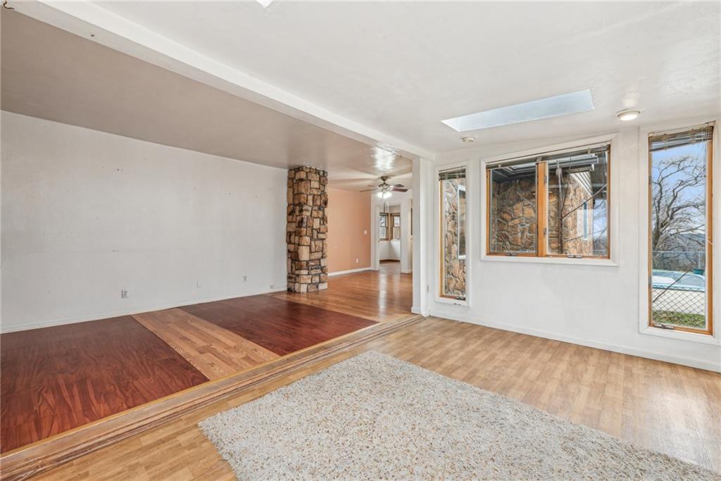 221 Woodside Road Irwin, PA 15642 - Photo 5 of 35 an empty room with wooden floor and windows