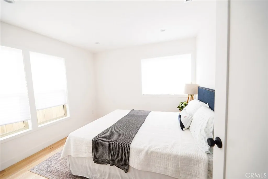 3642 6th Avenue Jefferson Park, CA 90018 - Photo 21 of 26 a bedroom with a bed and a window