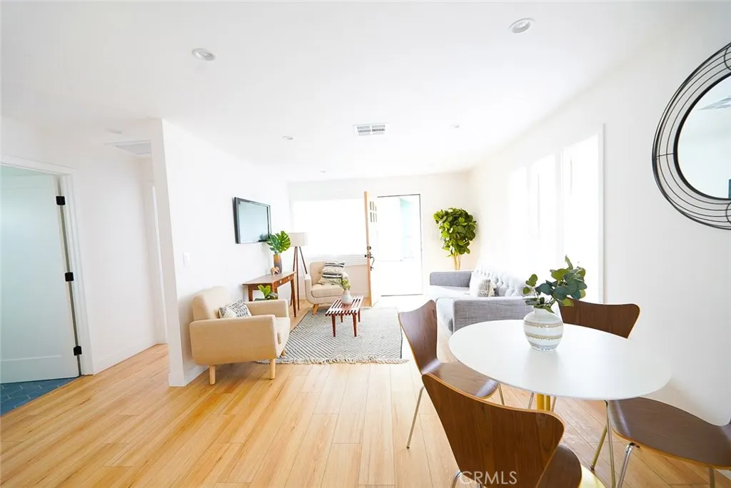 3642 6th Avenue Jefferson Park, CA 90018 - Photo 7 of 26 a living room with furniture and wooden floor