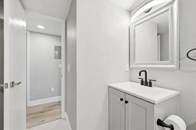 a bathroom with a sink and a mirror