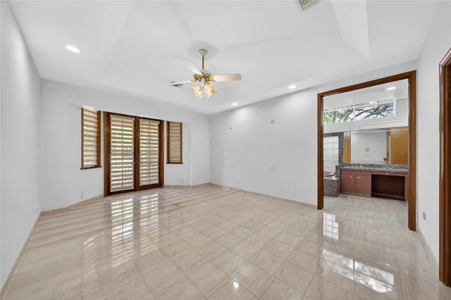a bathroom with a tub a sink and a shower