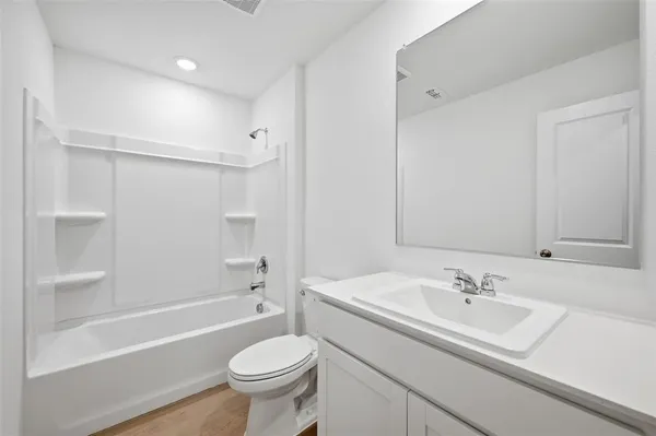 a bathroom with a sink toilet and a bathtub