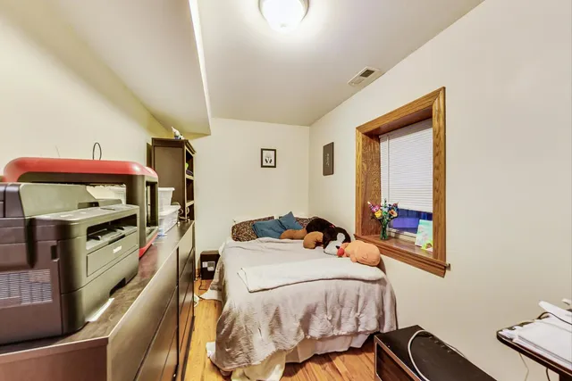 a bed room with a bed and a tv