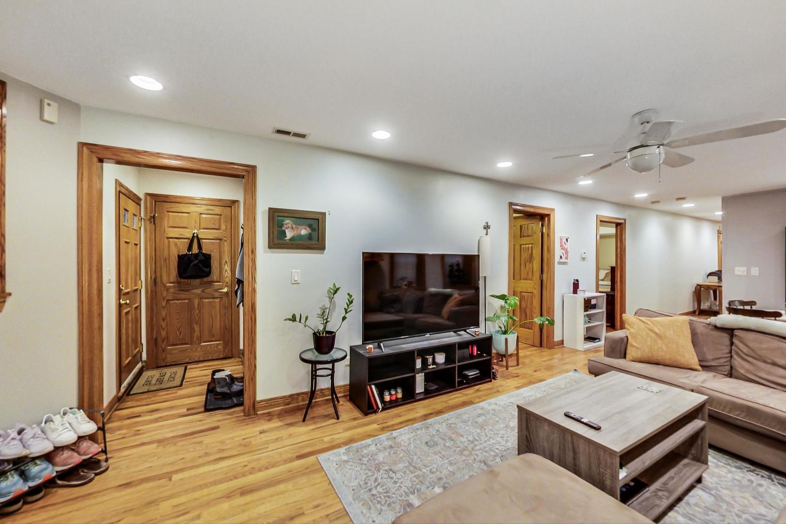 2911 North Talman Avenue, Unit 1 Chicago, IL 60618 - Photo 4 of 21 a living room with furniture and a flat screen tv