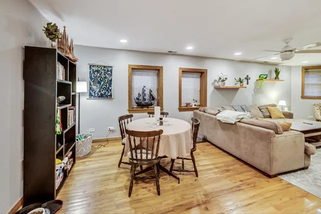 a living room with furniture and a book shelf