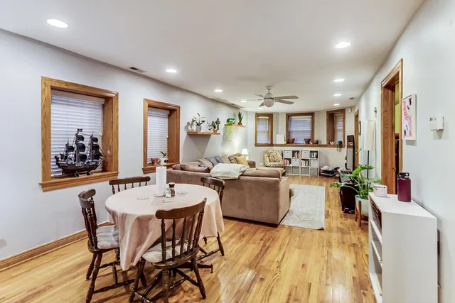 a large kitchen with a table and chairs