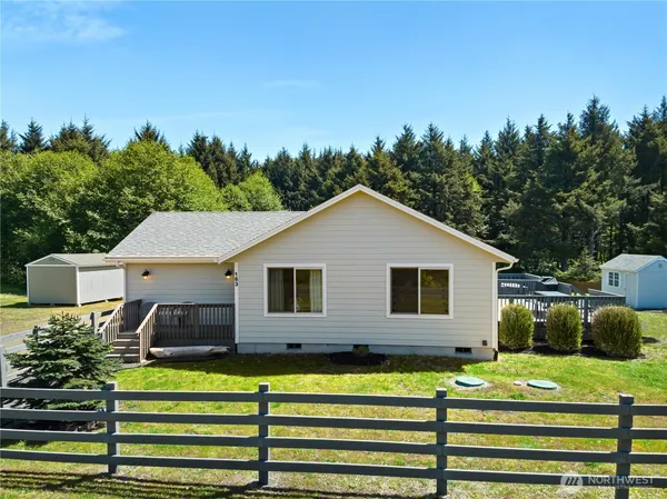 a view of a house with a yard