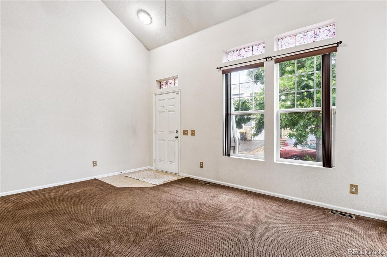 4658 Flower Street Wheat Ridge, CO 80033 - Photo 11 of 26 an empty room with a window