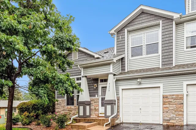a view of a house with a tree