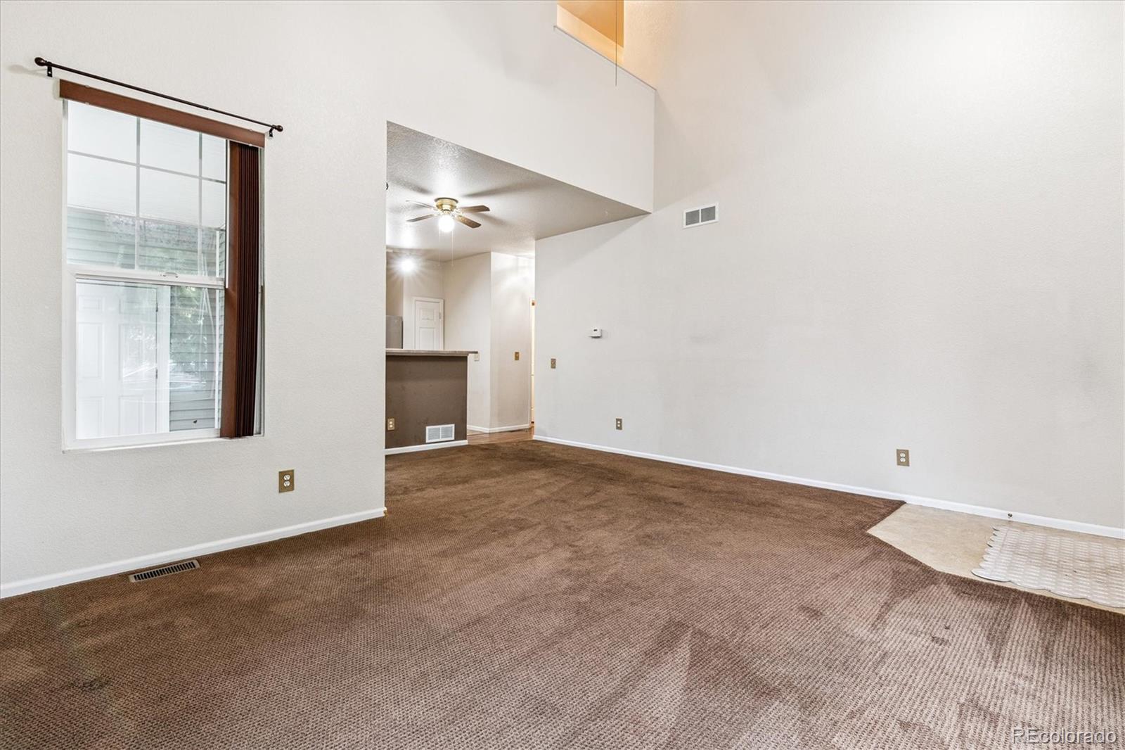 4658 Flower Street Wheat Ridge, CO 80033 - Photo 22 of 26 a view of an empty room with a window