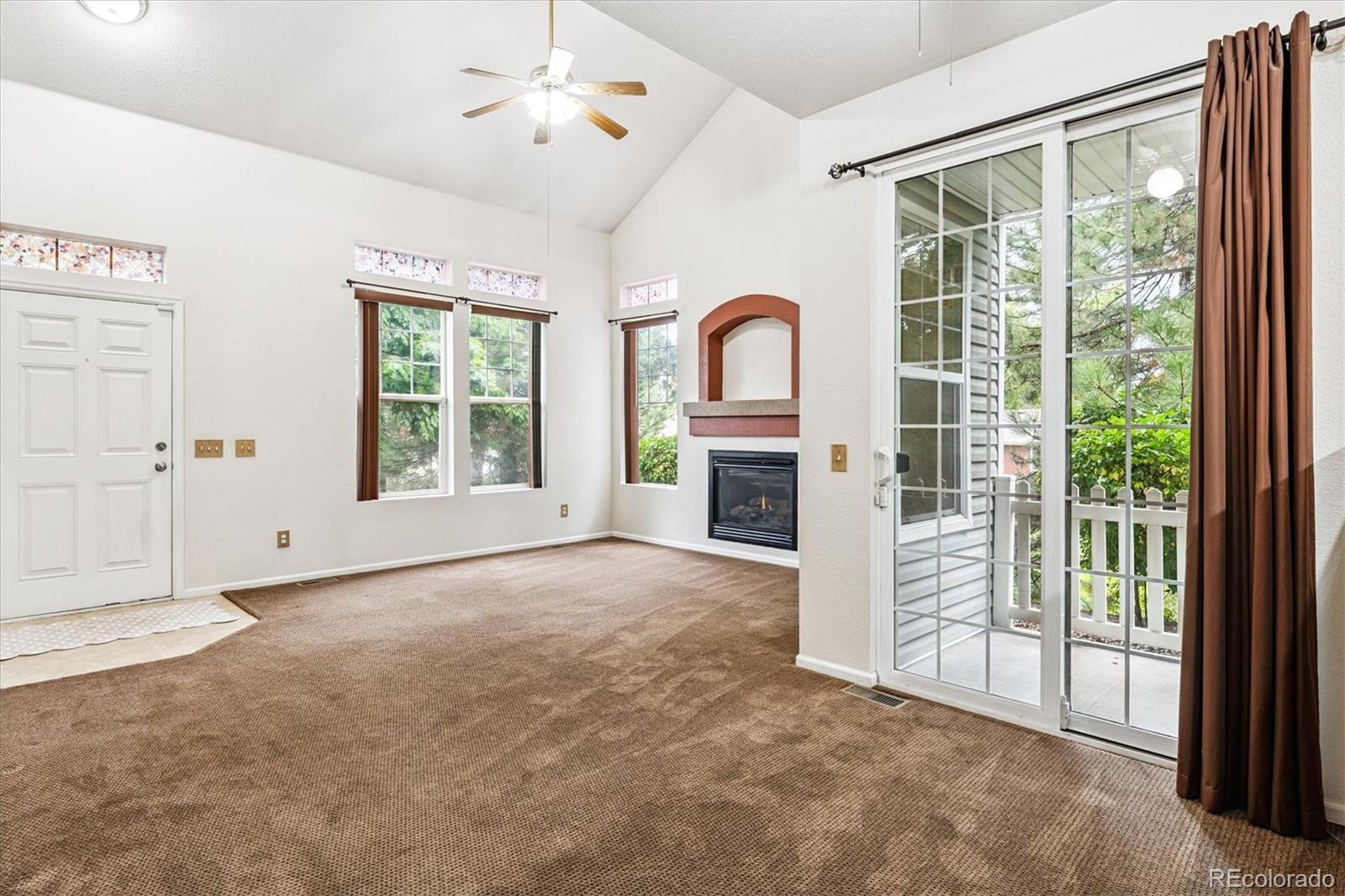 4658 Flower Street Wheat Ridge, CO 80033 - Photo 3 of 26 an empty room with windows and closet