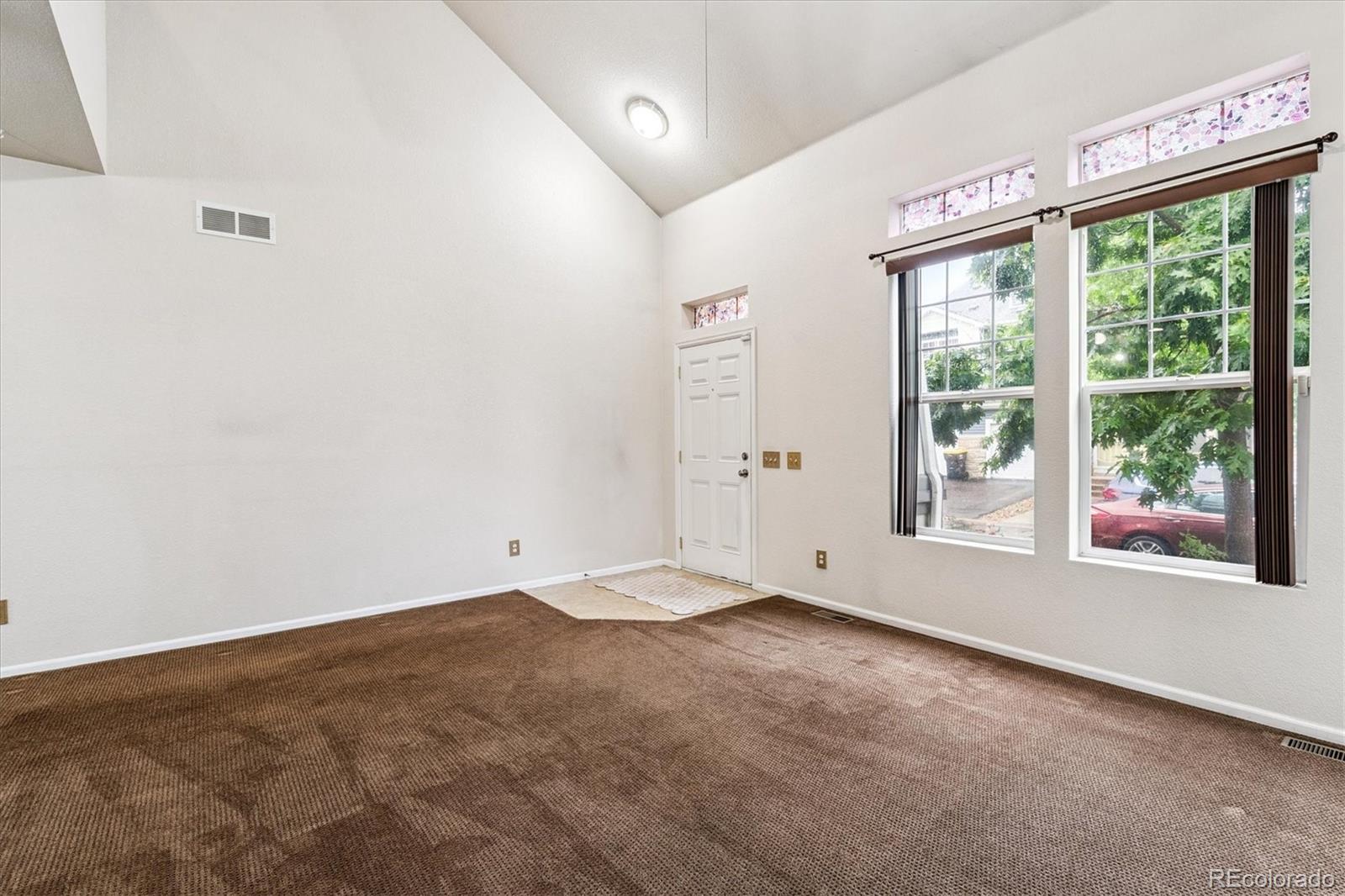 4658 Flower Street Wheat Ridge, CO 80033 - Photo 6 of 26 an empty room with a window