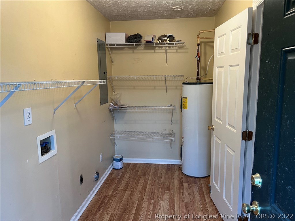 6859 Bailey Lake Road Fayetteville, NC 28304 - Photo 11 of 15 a view of walk in closet with empty racks