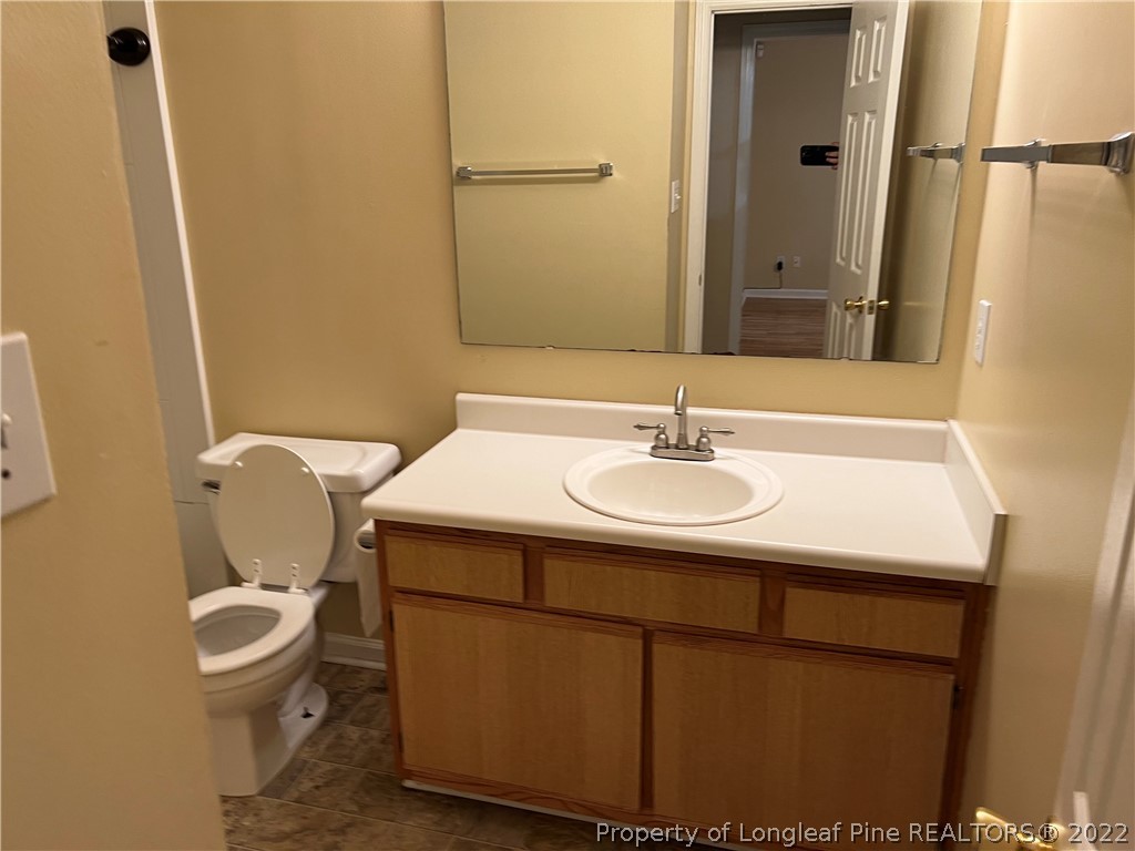 6859 Bailey Lake Road Fayetteville, NC 28304 - Photo 14 of 15 a bathroom with a sink and a toilet