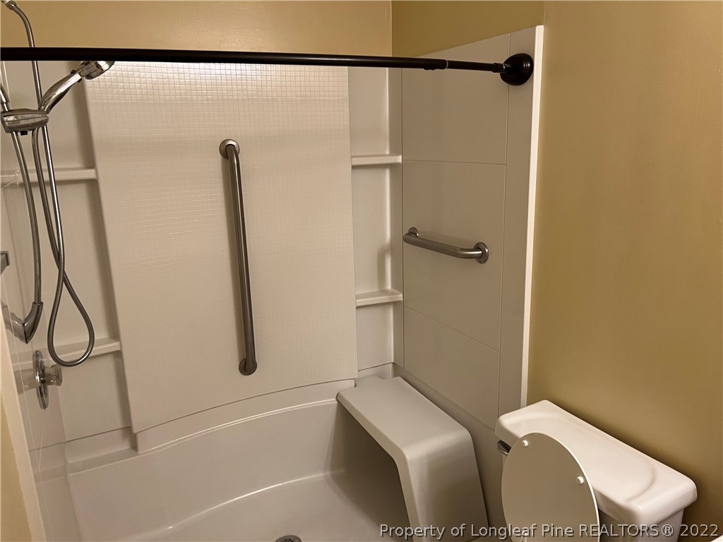 6859 Bailey Lake Road Fayetteville, NC 28304 - Photo 15 of 15 a bathroom with a toilet and shower
