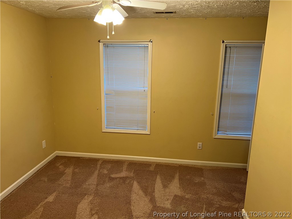 6859 Bailey Lake Road Fayetteville, NC 28304 - Photo 3 of 15 a view of an empty room with a window