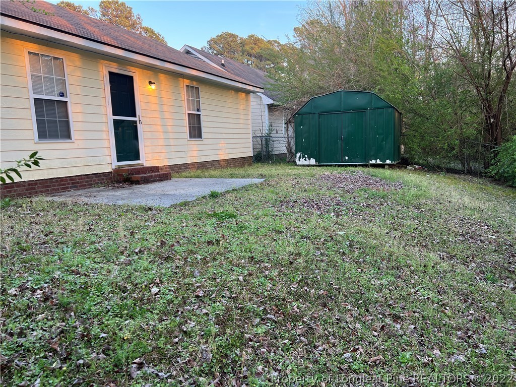 6859 Bailey Lake Road Fayetteville, NC 28304 - Photo 5 of 15 a view of a house with a yard