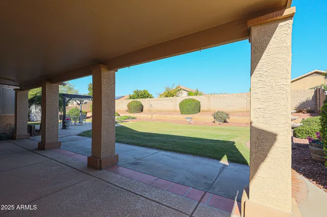 a view of backyard with sitting area