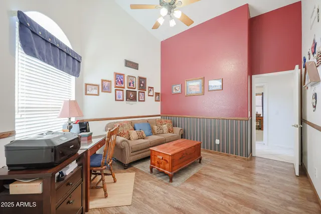 a bedroom with furniture and a window