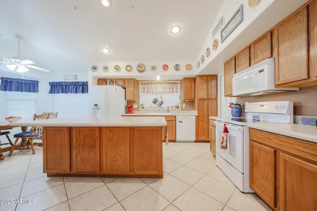 a kitchen with stainless steel appliances granite countertop a sink and cabinets