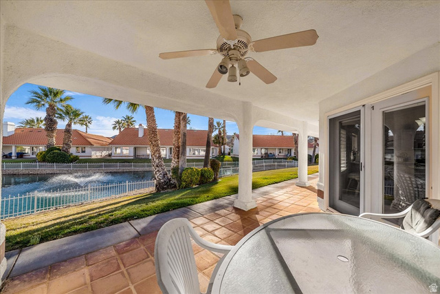 150 South Crystal Street, Unit 31 St. George, UT 84770 - Photo 3 of 20 View of patio / terrace featuring outdoor dining area, a ceiling fan, a residential view, and a water view