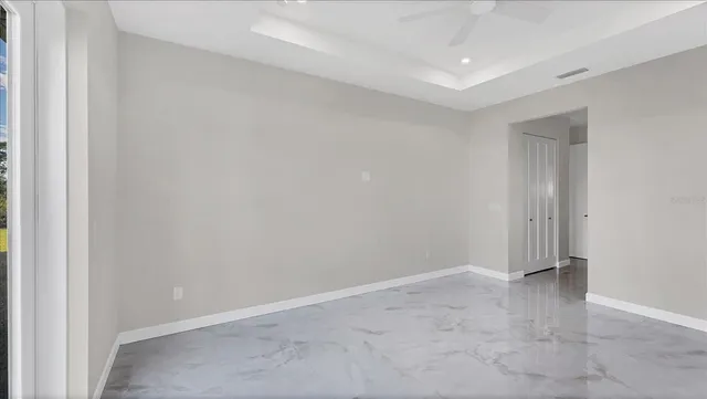 a bathroom with double vanity two mirror and a bathtub