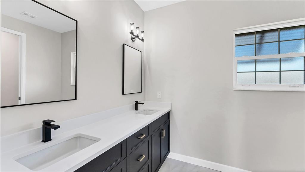 242 Brig Circle West Placida, FL 33946 - Photo 17 of 30 a bathroom with a sink and a mirror