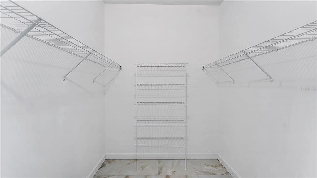 242 Brig Circle West Placida, FL 33946 - Photo 19 of 30 a view of walk in closet with empty racks