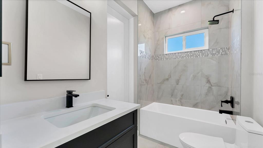 242 Brig Circle West Placida, FL 33946 - Photo 23 of 30 a bathroom with a sink a toilet and shower