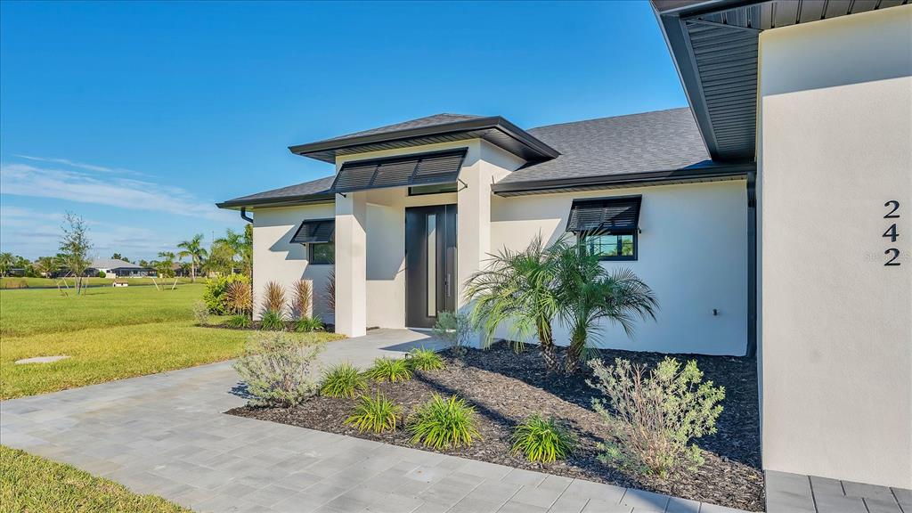 242 Brig Circle West Placida, FL 33946 - Photo 3 of 30 a front view of a house with garden