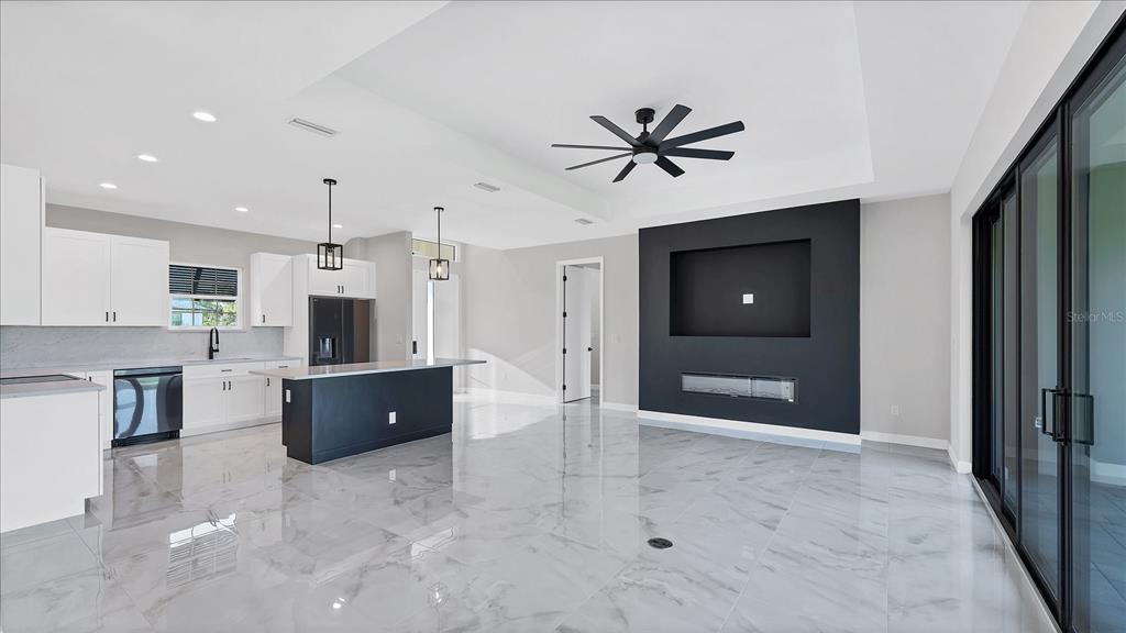 242 Brig Circle West Placida, FL 33946 - Photo 6 of 30 a view of a kitchen with a sink and a refrigerator