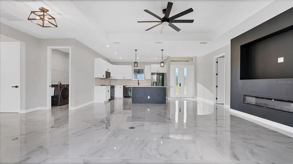 242 Brig Circle West Placida, FL 33946 - Photo 7 of 30 a view of kitchen with stainless steel appliances kitchen island refrigerator stove and a microwave oven