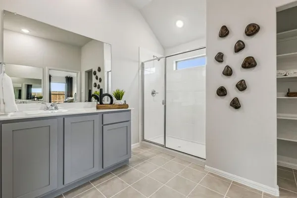 a en suite bathroom with a toilet sink and mirror