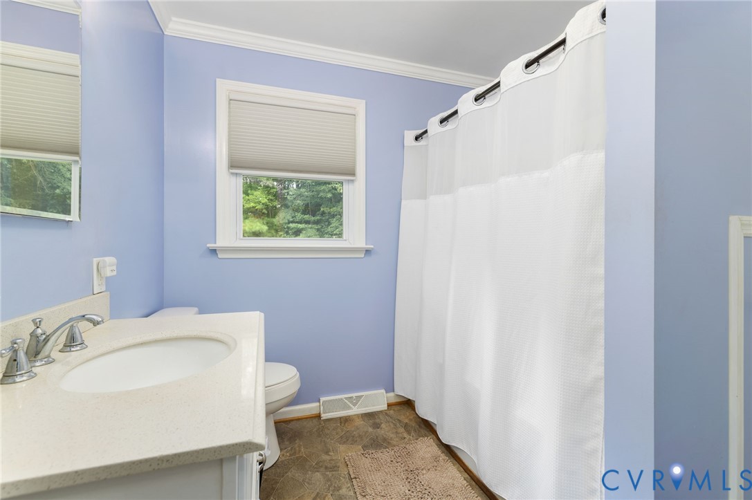 2570 Sandy Lane Victoria, VA 23974 - Photo 17 of 37 Bathroom with ornamental molding, vanity, stone fi