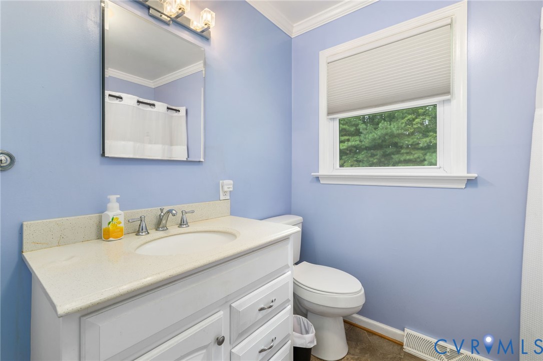 2570 Sandy Lane Victoria, VA 23974 - Photo 18 of 37 Bathroom with vanity, crown molding, and curtained