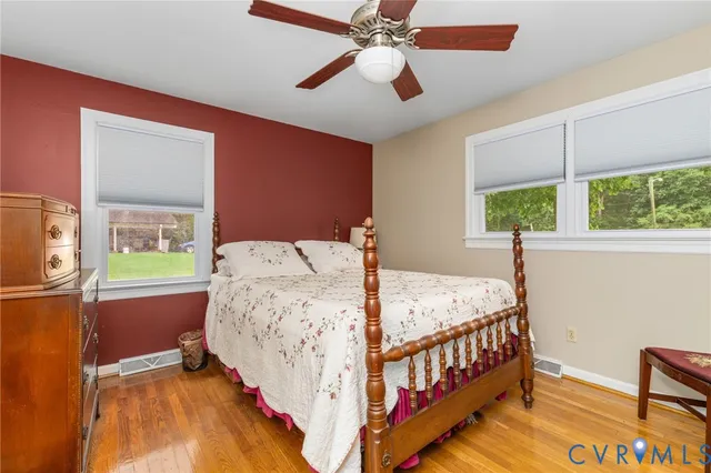 a bed room with a bed and a chandelier