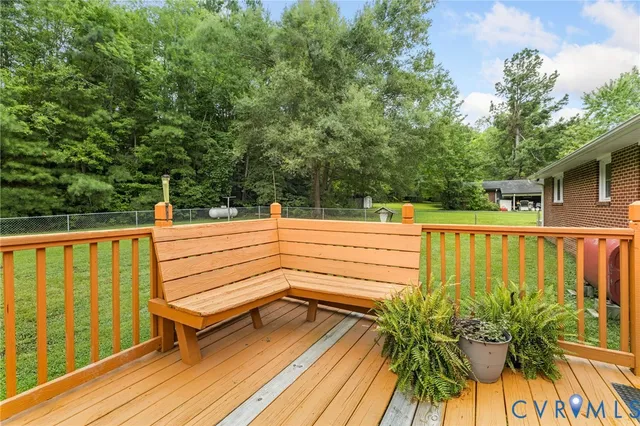 a view of outdoor space with deck and plants